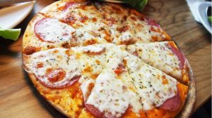 A traditional pepperoni and cheese pizza served at a local pizzeria in Wooster, OH